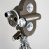 Винтажная кинокамера  "Bell & Howell" на "амортизирующий звездочке"